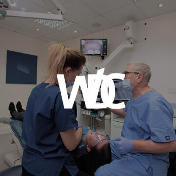 Weybridge Dental care logo overlayed on dentists working on a patient